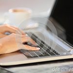 woman-hands-working-laptop-coffee-shop-close-up-table-47680808
